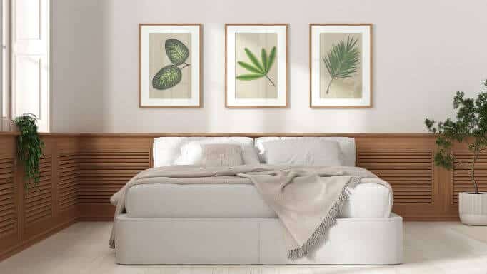 A bed with wood panelling around it