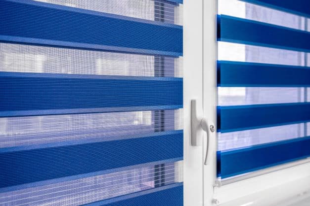 Blue blinds hanging on a window