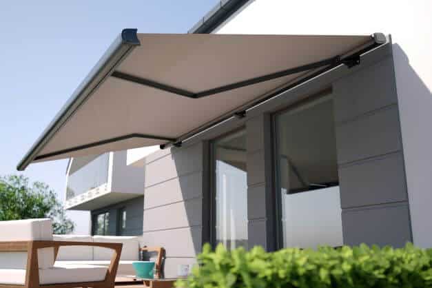 An extendable canopy attached to house