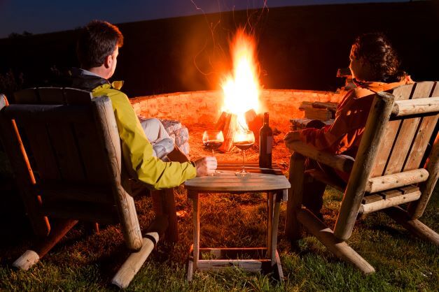 Top Reasons Why You Should Own A Fire Pit 1 couple sitting round firepit