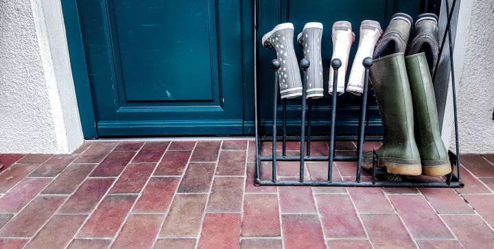 A boot rack with wellingtons