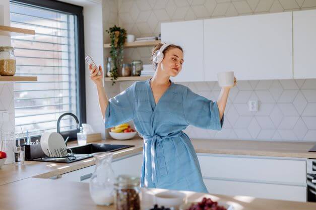 Lady dancing around utility room