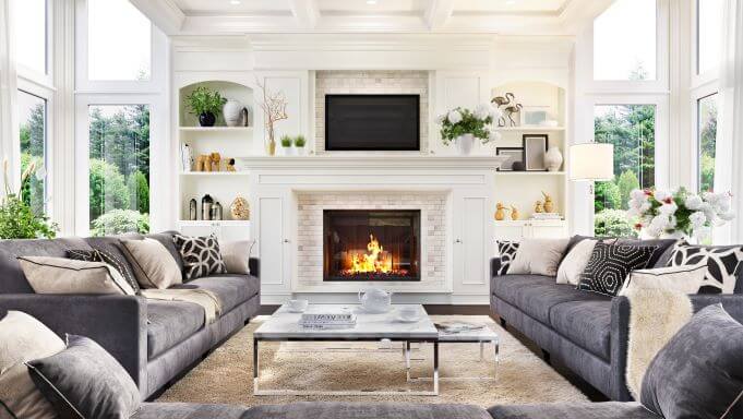 Stylish Fireplaces Guide, Advice and Considerations 2 A fireplace in centre of room surrounded by sofas
