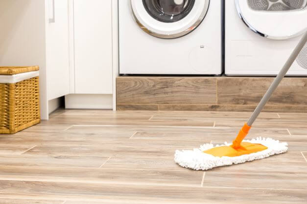 Utility room floor being mopped