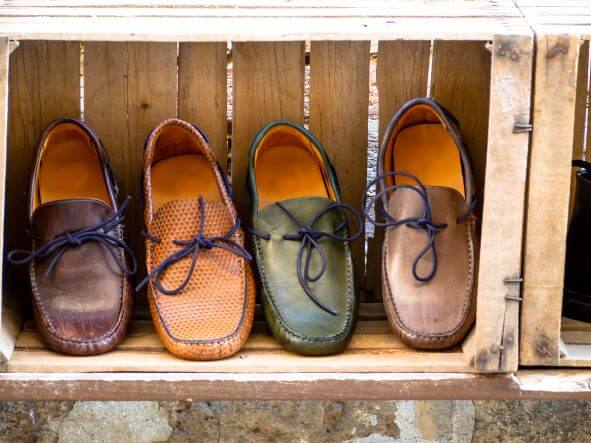Wooden fruit crate with shoes in