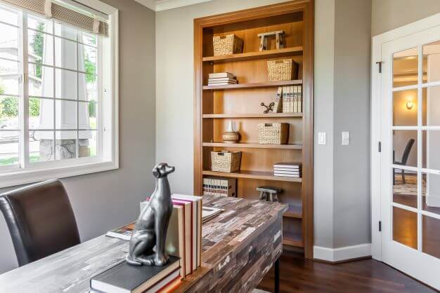Bespoke shelving in a garage converted to a home office