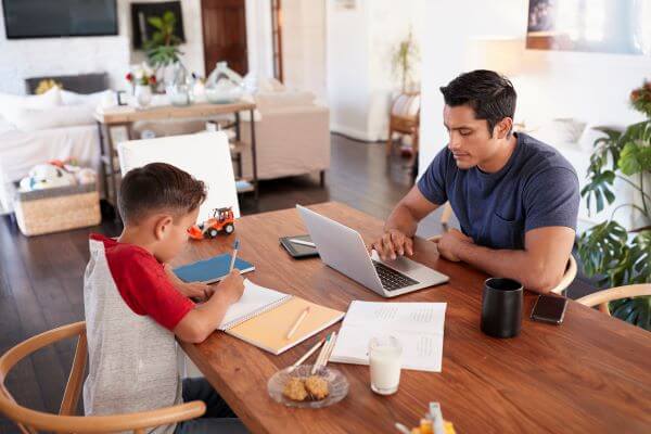 A family doing chores around the dinner table