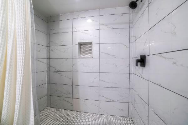 Different coloured grout will add contrast to your white tiles