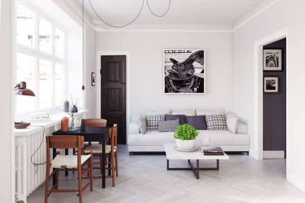A home with temporary dining chairs and tables against the window