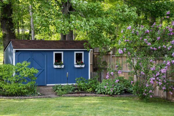 8 Fantastic Paint Colours For Your Garden Shed 2 A blue shed with white window frames